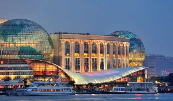 Shanghai urban architecture over river at dusk
